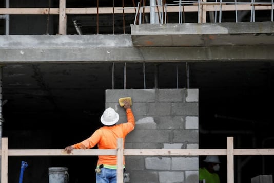 FILE PHOTO: A man works at a construction site, as Miami-Dade County eases some of the lockdown measures put in place during the coronavirus disease (COVID-19) outbreak, in Miami, Florida, U.S., May 18, 2020. REUTERS/Marco Bello/File Photo