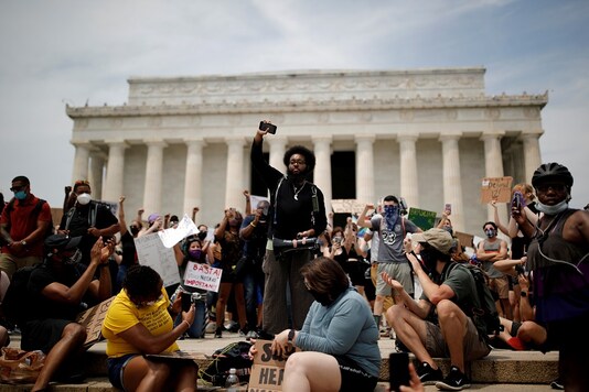 FILE PHOTO: Demonstrators gather at the Lincoln Memorial during a protest against racial inequality in the aftermath of the death in Minneapolis police custody of George Floyd, in Washington, U.S. REUTERS/Carlos Barria/File Photo