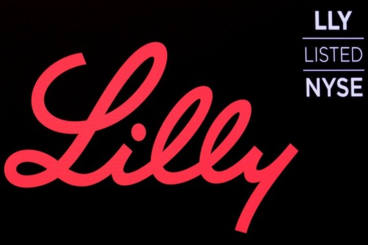 FILE PHOTO: The logo and ticker for Eli Lilly and Co. are displayed on a screen on the floor of the New York Stock Exchange (NYSE) in New York, U.S., May 18, 2018. REUTERS/Brendan McDermid