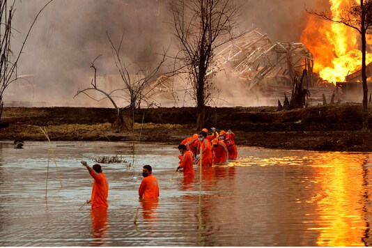 File photo of NDRF personnel at the site of the oil well blowout in Assam's Tinsukia. (AP)
