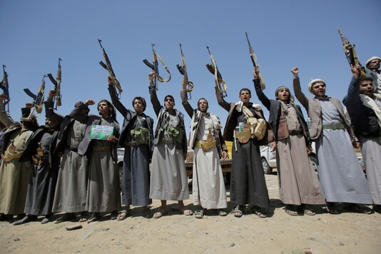 In this September 21, 2019, file photo, Shiite Houthi tribesmen hold their weapons as they chant slogans during a tribal gathering showing support for the Houthi movement, in Sanaa, Yemen. (AP Photo/Hani Mohammed, File)