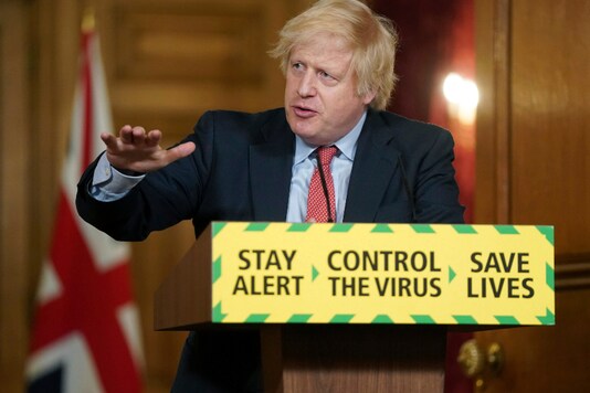 In this photo issued by 10 Downing Street, Britain's Prime Minister Boris Johnson gestures, during a coronavirus media briefing in Downing Street, London on June 10, 2020. (Pippa Fowles/10 Downing Street via AP)