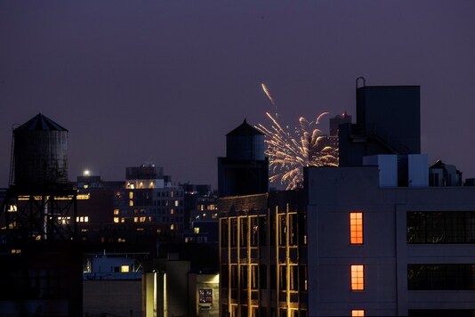 Illegal fireworks illuminate the sky over the skyline of the Brooklyn borough of New York City, New York, U.S., June 18, 2020. Picture taken June 18, 2020. REUTERS/Lucas Jackson