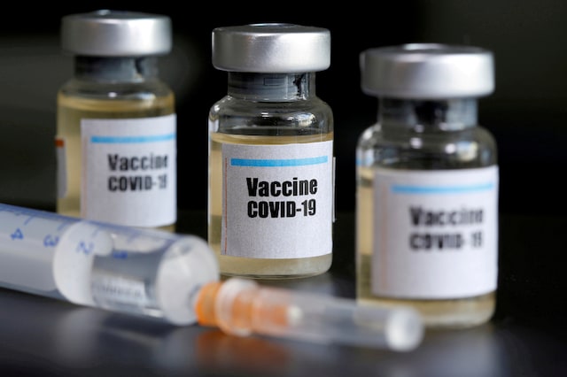 Small bottles labeled with a "Vaccine COVID-19" sticker and a medical syringe are seen in this illustration taken on April 10, 2020. (REUTERS/Dado Ruvic/Illustration)