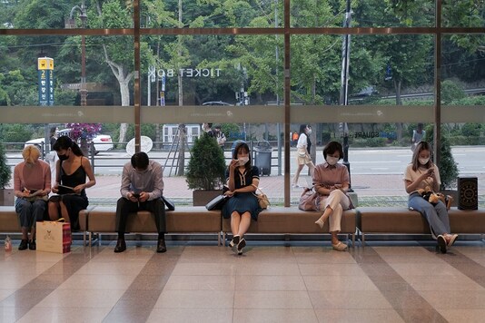 People wait in a line to watch Phantom of the Opera as the spread of the coronavirus disease (COVID-19) continues, at a theatre in Seoul, South Korea, June 18, 2020. REUTERS/Daewoung Kim