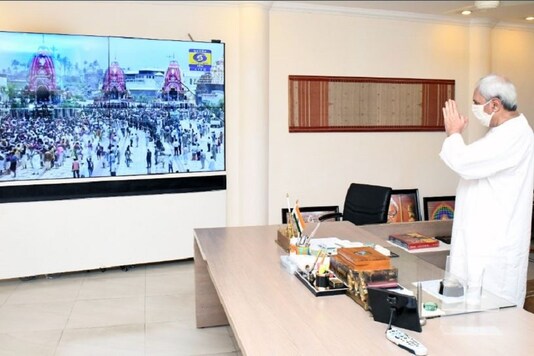 Odisha CM Naveen Patnaik watching the live telecast of Jagannath Rath Yatra at his office in Bhubaneswar. (Photo: Twitter/Naveen Patnaik)