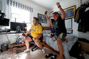 As Sporting Events Resume in Empty Stadiums, Fans Cheer For Their Teams From Afar