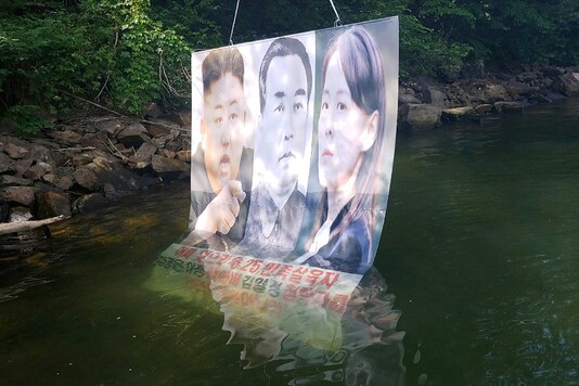 A balloon containing leaflets denouncing North Korean leader Kim Jong Un, released by a North Korean defector group on June 22, is seen at a hill in Hongcheon, South Korea.

 (Credit: REUTERS)