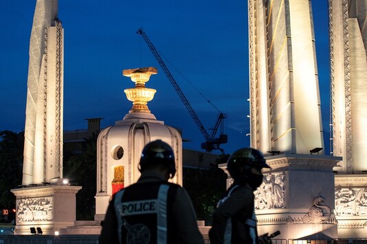 Police officers are seen next to the Democracy monument in Bangkok, Thailand. (Reuters/Athit Perawongmetha)