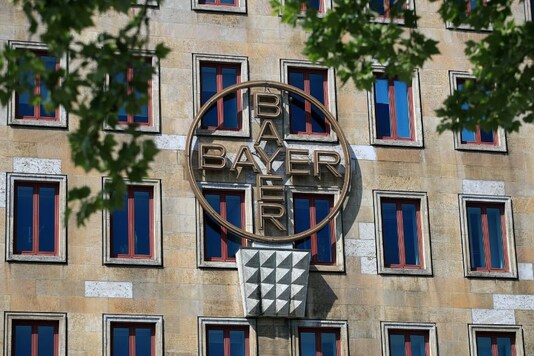 FILE PHOTO: The logo of Bayer AG is pictured at the facade of the historic headquarters of the German pharmaceutical and chemical maker in Leverkusen, Germany, April 27, 2020. (Reuters/Wolfgang Rattay/File Photo)