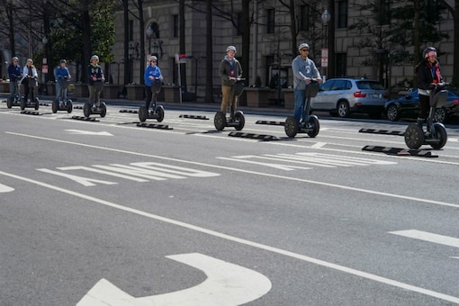 People ride Segway scooters in central Washington, U.S. (Image Source: Reuters)