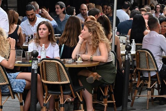 People sitting in a cafe in Paris.