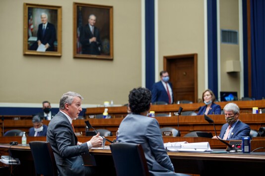 FILE - In this May 14, 2020, file pool photo Rick Bright, former director of the Biomedical Advanced Research and Development Authority, testifies before a House Energy and Commerce Subcommittee on Health hearing to discuss protecting scientific integrity in response to the coronavirus outbreak on Capitol Hill in Washington. Bright, a government whistleblower ousted from a leading role in battling COVID-19, alleged Thursday, June 25, that the Trump administration has intensified its campaign to punish him for revealing shortcomings in the U.S. response. (Shawn Thew/Pool via AP, File)