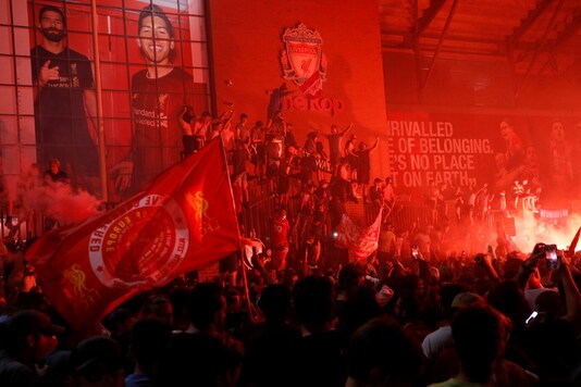 Liverpool fans celebrating the club's Premier League title victory. (Photo Credit: Reuters)