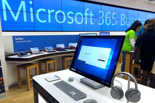 File photo of a Microsoft computer among items displayed at a Microsoft store in suburban Boston. (AP Photo/Steven Senne, File)