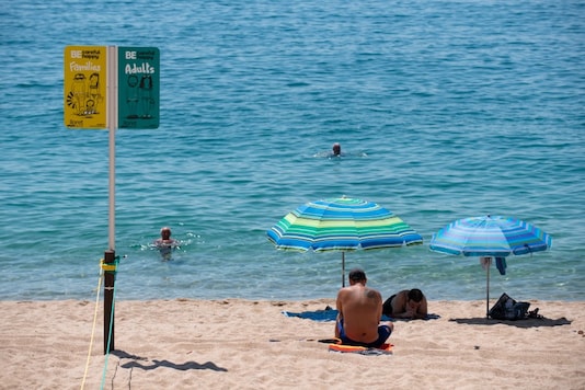 A Spanish beach demarcation sign to prevent overcrowding amid the Covid-19 pandemic. (Photo: Josep Lago/AFP)