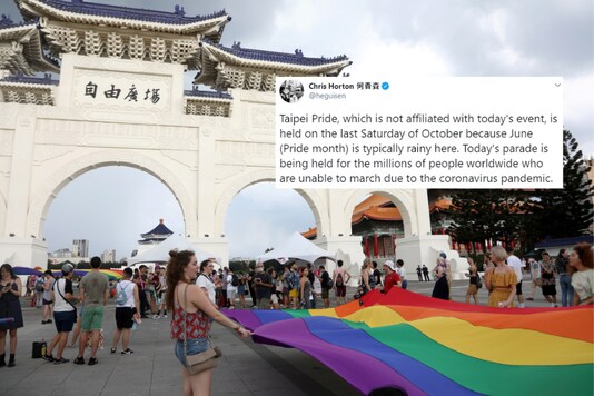 People carry a giant rainbow flag during the 
