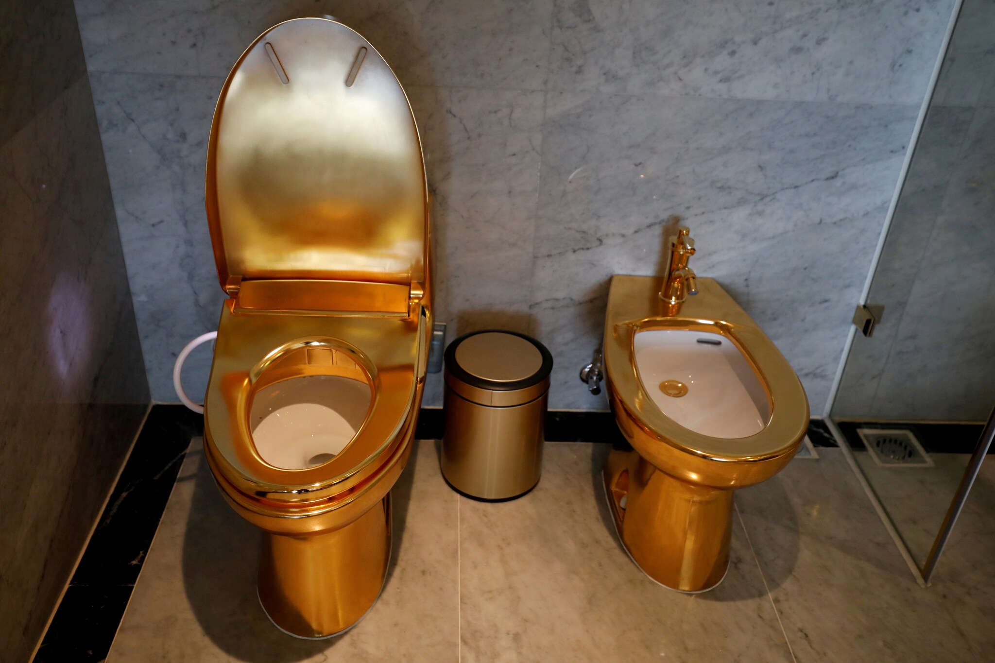 FILE PHOTO: Gold-plated toilets are seen at the newly inaugurated Dolce Hanoi Golden Lake hotel, after the government eased a nationwide lockdown following the global outbreak of the coronavirus disease (COVID-19), in Hanoi, Vietnam July 2, 2020. REUTERS/Kham/File Photo