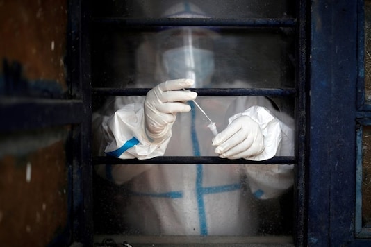 A health worker in personal protective equipment (PPE) puts a swab sample into a vial at a school which was turned into a centre to conduct tests for the coronavirus disease (COVID-19), amid the spread of the disease. (Representational Image: Reuters) A health worker in personal protective equipment (PPE) puts a swab sample into a vial at a school which was turned into a centre to conduct tests for the coronavirus disease (COVID-19), amid the spread of the disease. (Representational Image: Reuters)