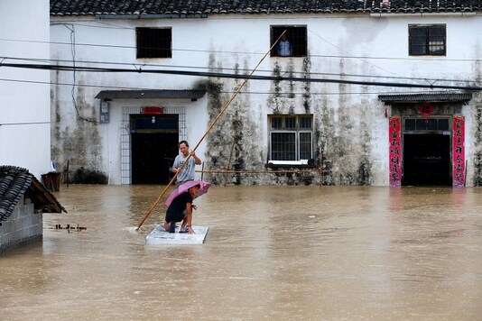 Mưa lớn không dứt, Trung Quốc nâng phản ứng lũ lụt lên mức cao thứ 2 - Ảnh 7.