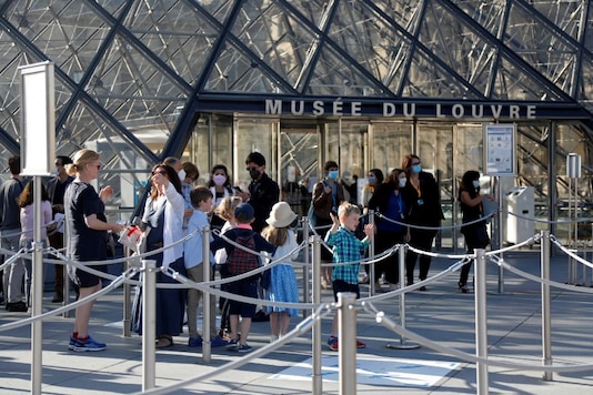 File photo of visitors in front of the Louvre Pyramid designed by Chinese-born U.S. architect Ieoh Ming Pei in Paris as the museum reopens its doors to the public after almost 4-month closure due to the coronavirus disease (COVID-19) outbreak in France. (Image: Reuters) File photo of visitors in front of the Louvre Pyramid designed by Chinese-born U.S. architect Ieoh Ming Pei in Paris as the museum reopens its doors to the public after almost 4-month closure due to the coronavirus disease (COVID-19) outbreak in France. (Image: Reuters)