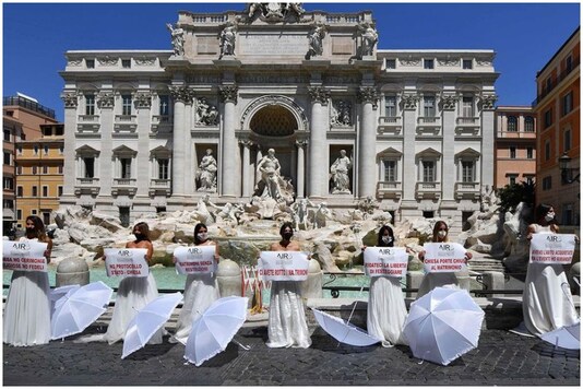 Women protestin in wedding dresses to oppose coronavirus restrictions in Rome | Image credit: AFP Women protestin in wedding dresses to oppose coronavirus restrictions in Rome | Image credit: AFP