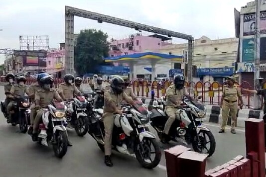 Lucknow Police personnel take out bike rally to drive away locusts. (News18)
