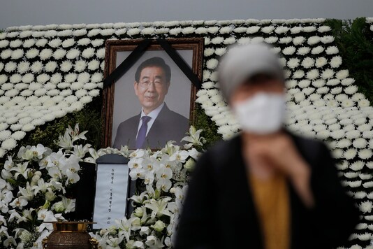 A mourner passes by a memorial altar for late Seoul Mayor Park Won-soon at City Hall Plaza in Seoul, South Korea. (AP)