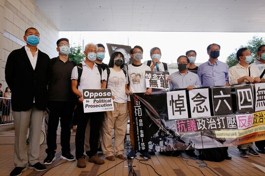 Pro-democracy activists, including Lee Cheuk-yan and media tycoon Jimmy Lai, arrive at the West Kowloon Courts before entering a courtroom to face charges related to illegal assembly during Tiananmen vigil, in Hong Kong, China July 13, 2020. REUTERS/Tyrone Siu
