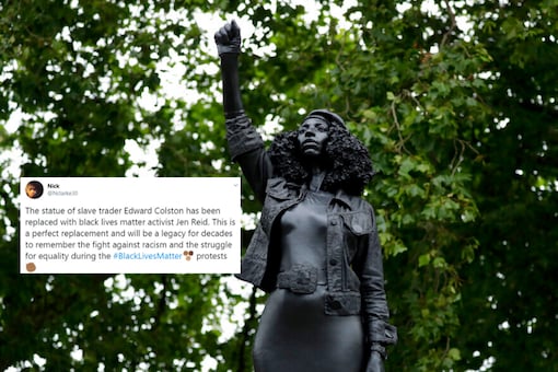 A new black resin and steel statue entitled "A Surge of Power (Jen Reid) 2020" by artist Marc Quinn stands after the statue was put up this morning on the empty plinth of the toppled statue of 17th century slave trader Edward Colston, which was pulled down during a Black Lives Matter protest in Bristol, England, Wednesday, July 15, 2020. 