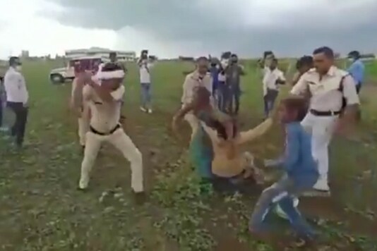 A video that went viral on social media showed the police beating the man with batons severely while his wife and others were trying to save him. A video that went viral on social media showed the police beating the man with batons severely while his wife and others were trying to save him.