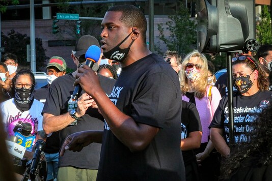 Mondaire Jones, winner of the Democratic primary for the 17th Congressional District, addresses a Black Lives Matter rally, Wednesday, July 15, 2020, outside the Westchester County courthouse in White Plains, N.Y. If he wins in November, Jones will join a record number of openly-LGBTQ elected officials in the United States. (AP Photo/Bebeto Matthews)