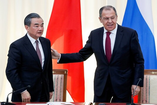 FILE PHOTO: Russian Foreign Minister Sergey Lavrov and Chinese Foreign Minister Wang Yi leave after their joint news conference following talks in Sochi, Russia May 13, 2019. (Pavel Golovkin/Pool via REUTERS)