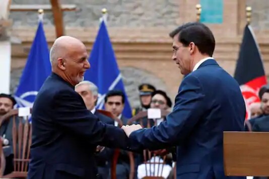 Afghanistan's President Ashraf Ghani shakes hands with US Defense Secretary Mark Esper, during a news conference in Kabul, Afghanistan. (Reuters)