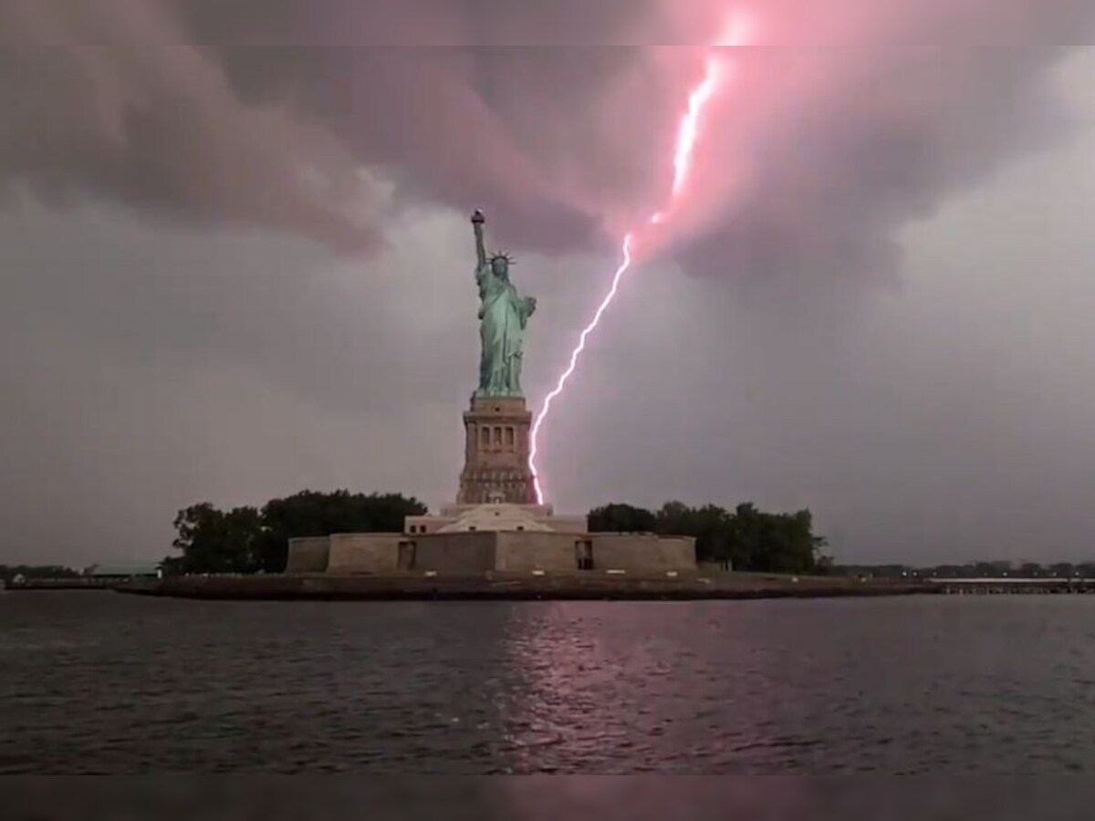 Man Captures Exact Moment When Lightning Strikes Statue Of Liberty Amid Storm In New York
