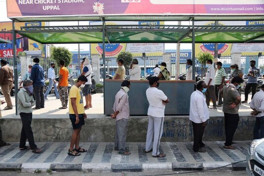 People line up to buy grocery during lockdown as a precautionary measure against COVID-19 in Hyderabad, Telangana. (AP Photo)