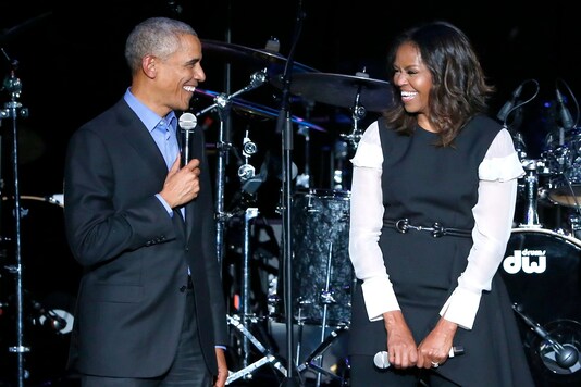 FILE - Former President Barack Obama, left, and former first lady Michelle Obama. (AP Photo/Charles Rex Arbogast, file)
