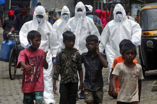 Health workers in a slum in Mumbai. (Reuters)