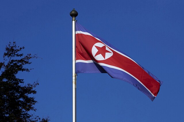 FILE PHOTO: A North Korean flag flies on a mast at the Permanent Mission of North Korea in Geneva October 2, 2014.   REUTERS/Denis Balibouse