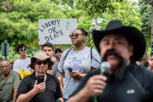 People protest against mandates to wear masks amid the coronavirus disease (COVID-19) outbreak in Austin, Texas, U.S., June 28, 2020. REUTERS/Sergio Flores
