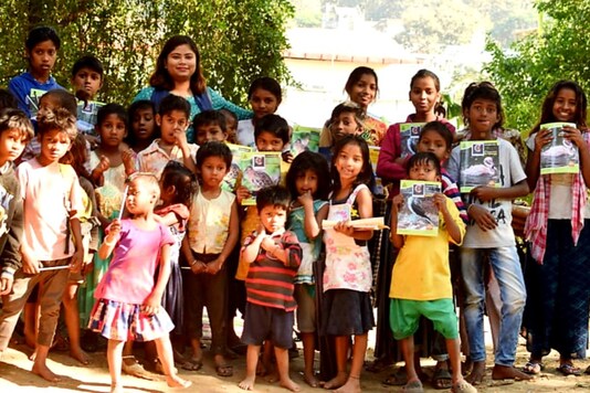 Julie Kakoty with her students before the pandemic. (Special arrangement/News18)