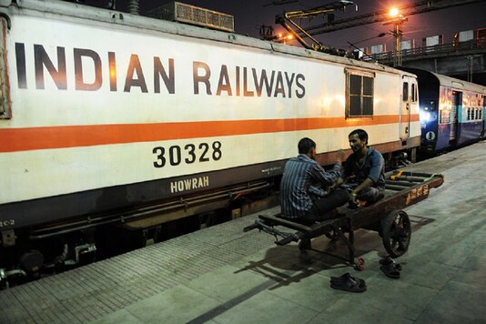 For representation: Porters in front of a Electric rail engine at Howrah Station on February 26, 2015 in Howrah, India. (Photo by Indranil Bhoumik/Mint via Getty Images)