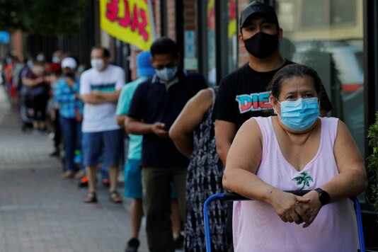 People line up for free groceries in the US. (Reuters)