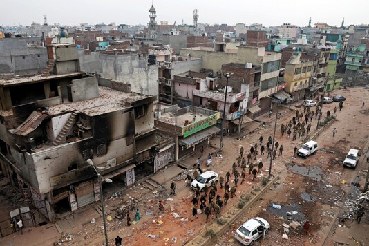 File photo of security forces patrolling a riot-affected area following clashes in Northeast Delhi in February. (Reuters)