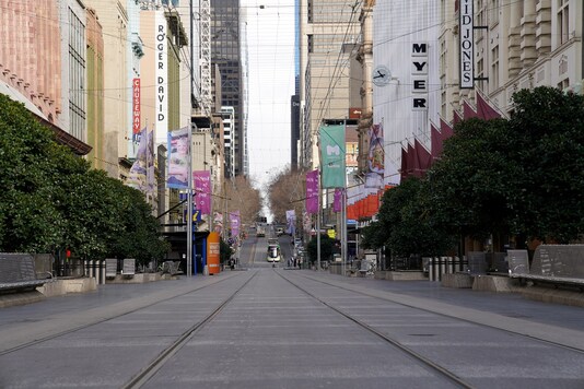 Bourke Street mall, a normally busy shopping hub in Melbourne, is seen devoid of people after the city re-entered Stage 3 restrictions as part of efforts to curb a resurgence of the coronavirus disease on July 23, 2020. (REUTERS/Sandra Sanders)