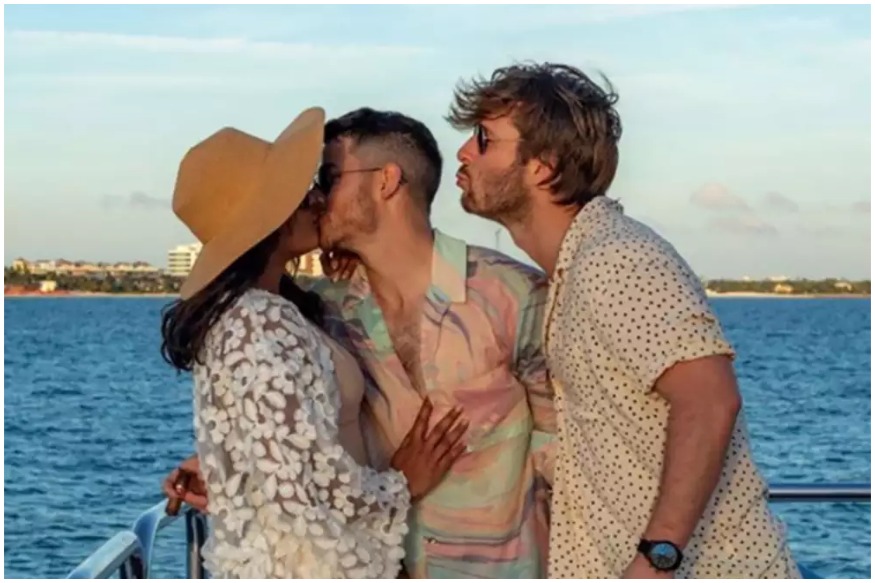  Nick Jonas shared an adorable picture on social media, wherein he is seen kissing his wife Priyanka Chopra in the presence of his close friend actor Glen Powell.