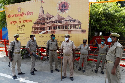 Policemen stand guard ahead of ceremony of Ram temple in Ayodhya, Uttar Pradesh, Tuesday, Aug. 4, 2020. The ceremony followed Supreme Court's ruling favouring the building of a Hindu temple on the disputed site. (AP Photo/Rajesh Kumar Singh)