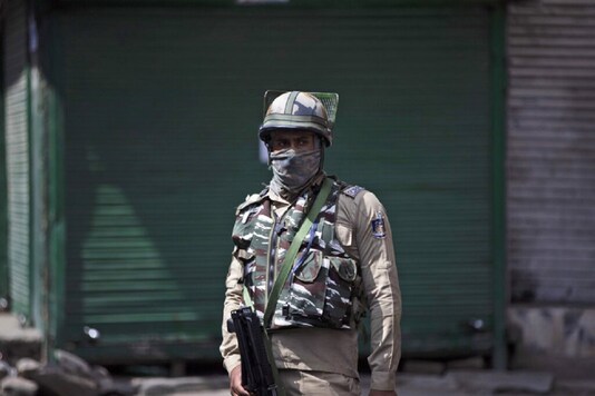 Image for representation. A paramilitary soldier stands guard during curfew in Srinagar on August 4. (Photo: AP) 