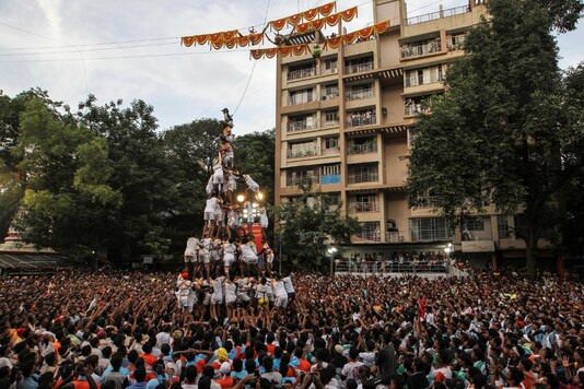 File photo: Devotees form a human pyramid to break a clay pot containing curd during the Hindu festival of Janmashtami, marking the birth anniversary of Hindu Lord Krishna, in Mumbai. (Reuters)