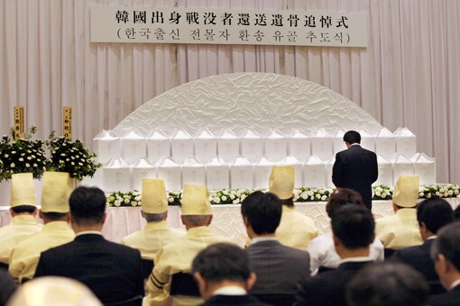 A ceremony to commemorate the returning to South Korea the remains of Korean solders who died while serving in the Japanese Army during World War II, is held at Buddhist temple, Yutenji, in Tokyo on May 18, 2010. (Kyodo News via AP)